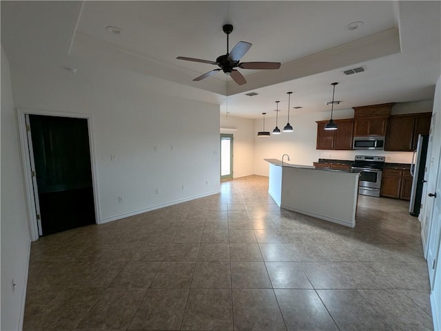 2905 Dante Dr, Corpus Christi, TX 78415 - kitchen with stainless steel appliances, a raised ceiling, open floor plan, and a ceiling fan