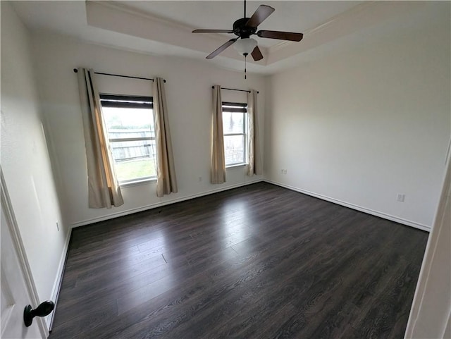 2905 Dante Dr, Corpus Christi, TX 78415 - spare room with ceiling fan, dark wood-style flooring, and a tray ceiling