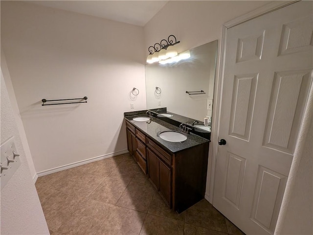 2905 Dante Dr, Corpus Christi, TX 78415 - bathroom featuring double vanity and tile patterned flooring