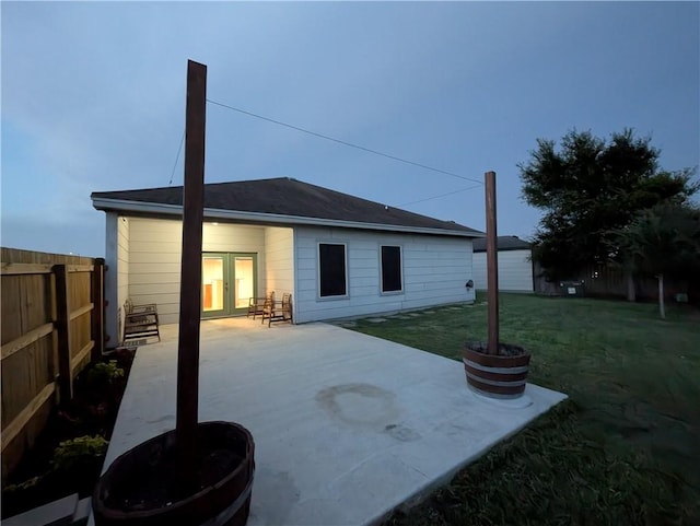 2905 Dante Dr, Corpus Christi, TX 78415 - back of property with french doors, a fenced backyard, and a patio