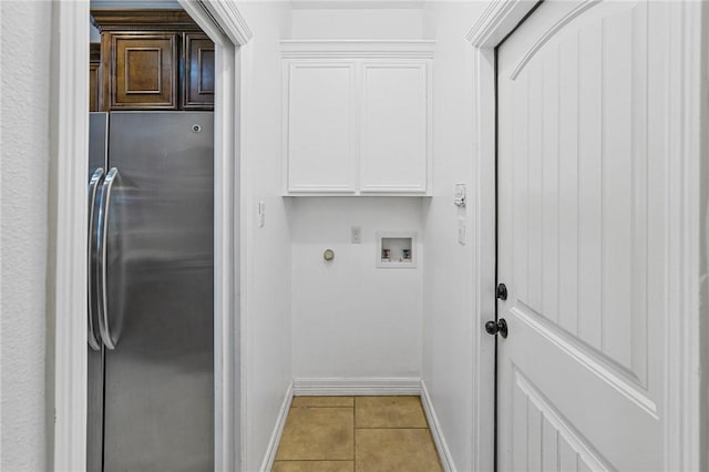 2633 Date Palm Dr, Corpus Christi, TX 78418 - washroom featuring cabinet space, light tile patterned floors, baseboards, and hookup for a gas dryer
