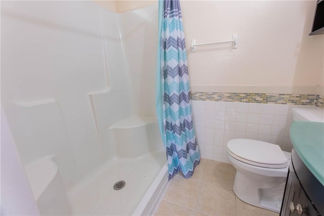 3814 Whitney Dr, Corpus Christi, TX 78410 - bathroom featuring vanity, curtained shower, tile walls, tile patterned flooring, and a wainscoted wall