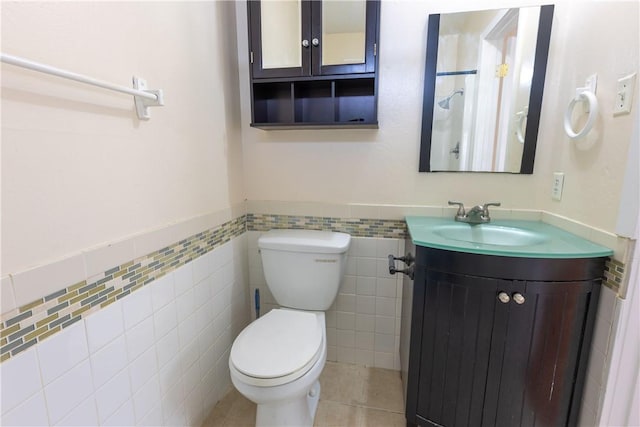 3814 Whitney Dr, Corpus Christi, TX 78410 - bathroom with tile walls, vanity, wainscoting, and tile patterned flooring
