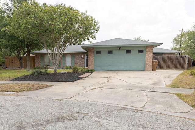 3814 Whitney Dr, Corpus Christi, TX 78410 - view of front of house with brick siding, driveway, and a garage