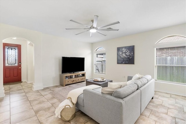 8129 Resplandor St, Corpus Christi, TX 78414 - living area with arched walkways, ceiling fan, plenty of natural light, and baseboards