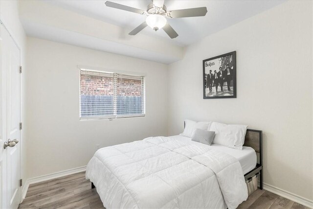 8129 Resplandor St, Corpus Christi, TX 78414 - bedroom with wood finished floors, baseboards, and a ceiling fan
