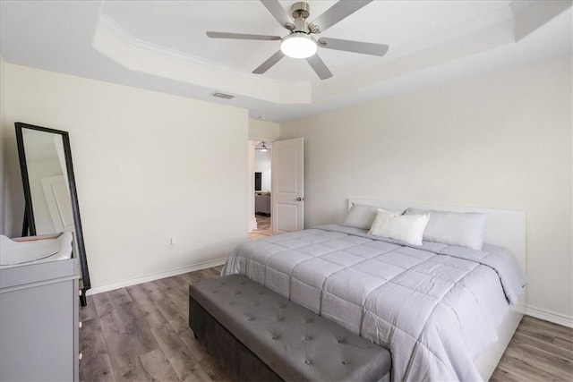 8129 Resplandor St, Corpus Christi, TX 78414 - bedroom with a raised ceiling, crown molding, wood finished floors, baseboards, and ceiling fan