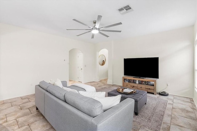 8129 Resplandor St, Corpus Christi, TX 78414 - living room featuring arched walkways, a ceiling fan, and baseboards