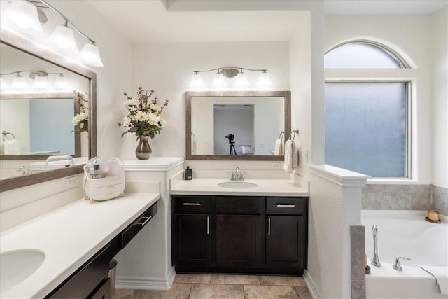 8129 Resplandor St, Corpus Christi, TX 78414 - bathroom featuring a garden tub and two vanities