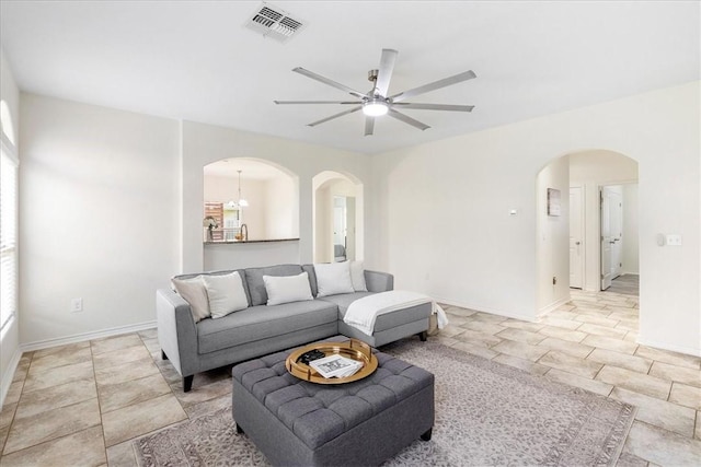 8129 Resplandor St, Corpus Christi, TX 78414 - living room with arched walkways, ceiling fan, and baseboards