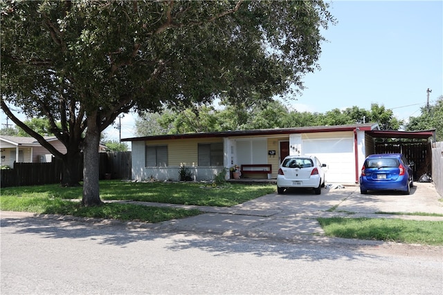 ranch-style home with a front lawn and a carport