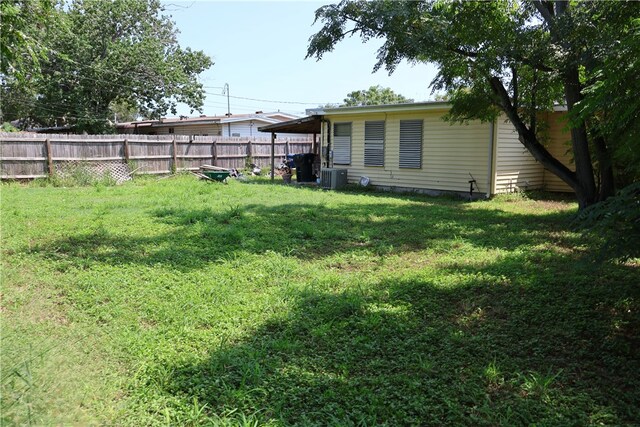 view of yard with central air condition unit