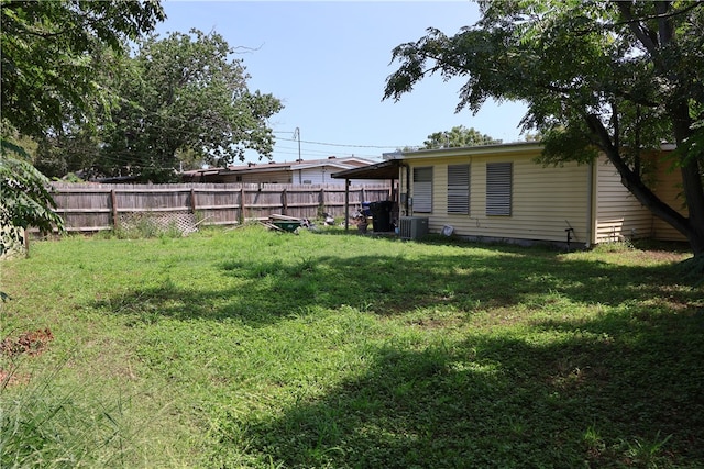 view of yard featuring central air condition unit