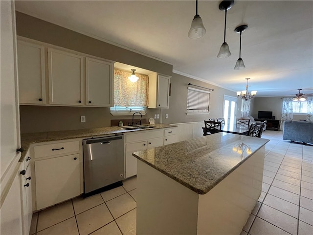 kitchen featuring dishwasher, white cabinetry, a wealth of natural light, and a center island