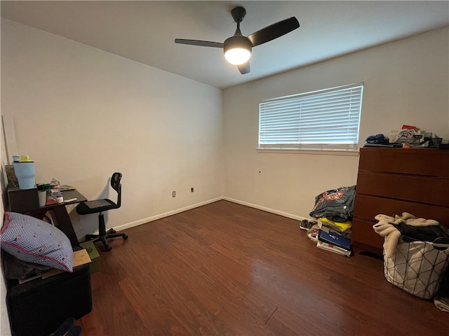 office area with dark wood-type flooring and ceiling fan