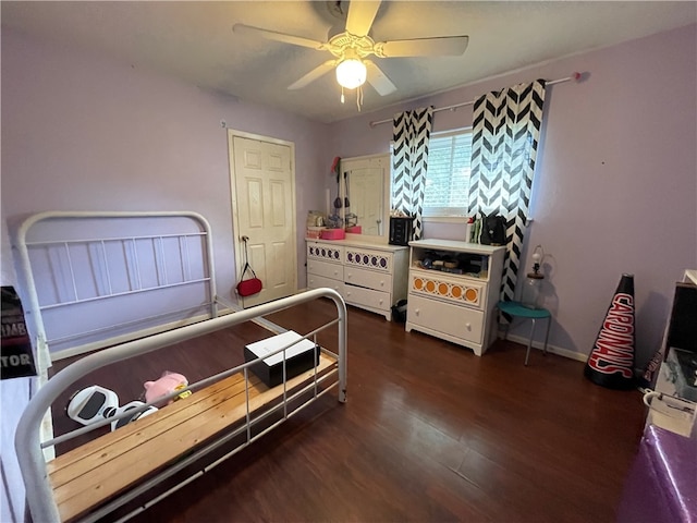 bedroom with ceiling fan and dark hardwood / wood-style floors