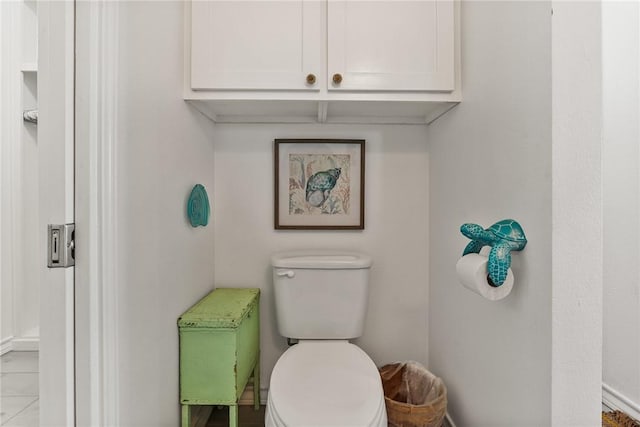 bathroom featuring tile patterned flooring and toilet