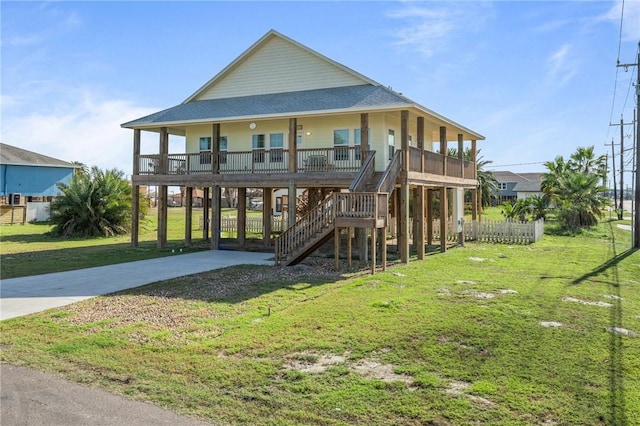 exterior space featuring a lawn, a carport, and covered porch