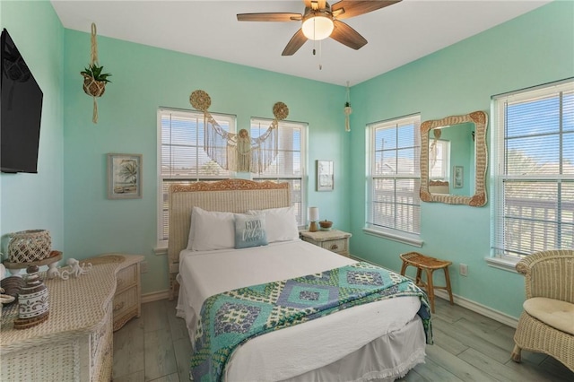 bedroom featuring ceiling fan and light hardwood / wood-style floors