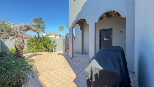 view of patio / terrace featuring fence and grilling area