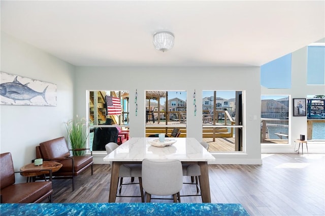 dining area with wood finished floors