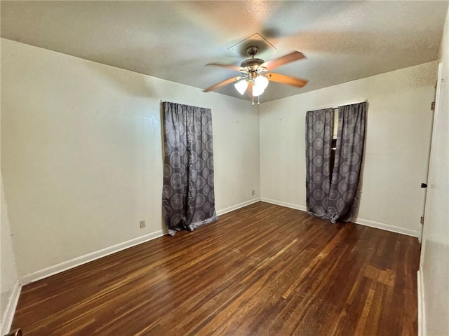 unfurnished room with dark hardwood / wood-style floors and ceiling fan