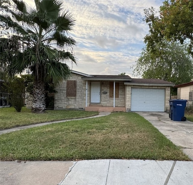 single story home featuring a garage and a front lawn