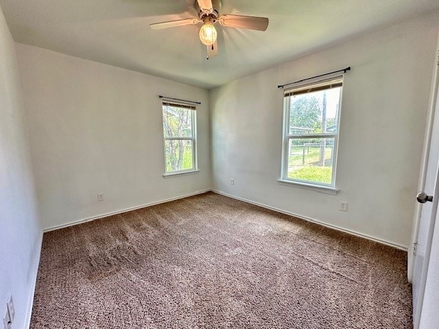 carpeted empty room with ceiling fan