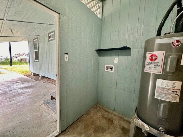 utility room featuring water heater