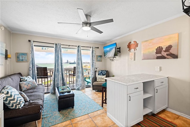 3938 Surfside Blvd Unit 1316, Corpus Christi, TX 78402 - living room featuring light tile patterned floors, ceiling fan, crown molding, and a textured ceiling
