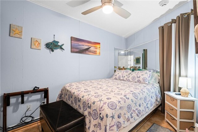 3938 Surfside Blvd Unit 1316, Corpus Christi, TX 78402 - tiled bedroom featuring ornamental molding and ceiling fan