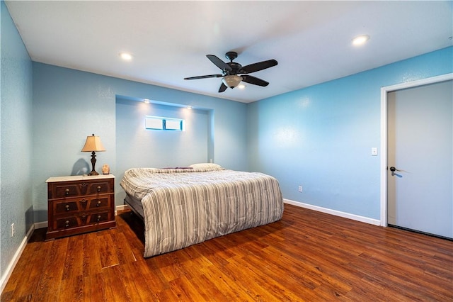 bedroom featuring dark wood-type flooring and ceiling fan