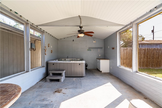 sunroom featuring plenty of natural light, lofted ceiling, and ceiling fan