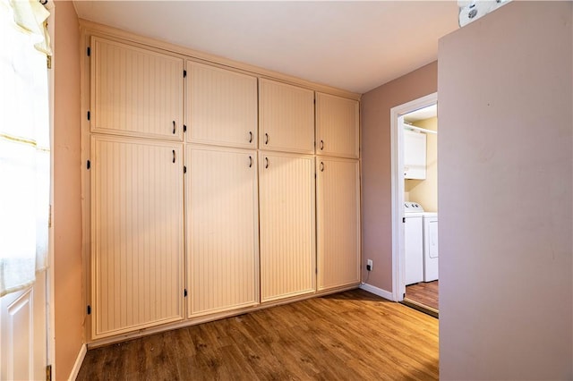 177 Grapevine Dr, Rockport, TX 78382 - mudroom featuring wood finished floors, separate washer and dryer, and baseboards
