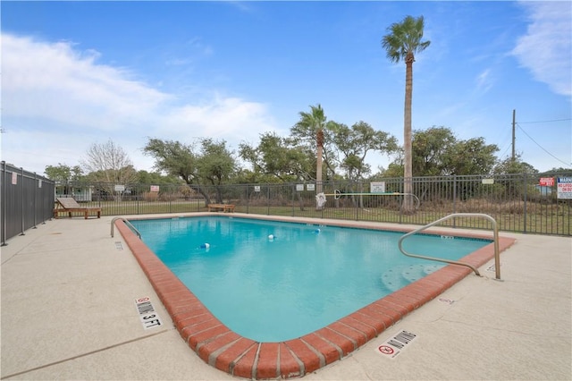 view of pool featuring a patio