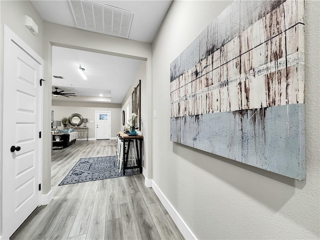 corridor featuring light hardwood / wood-style floors