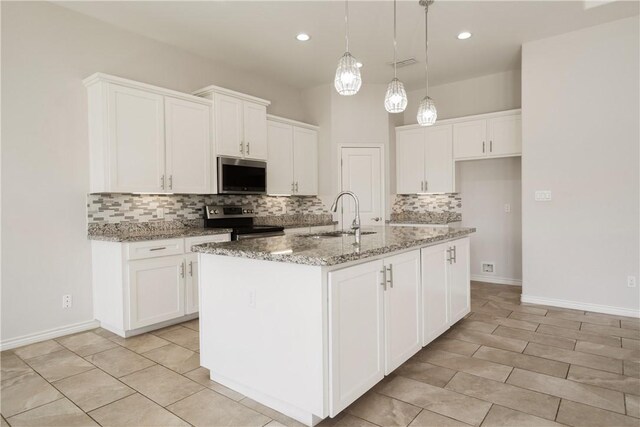 kitchen with appliances with stainless steel finishes, white cabinetry, and a sink