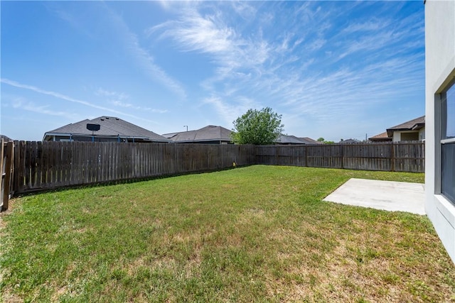 view of yard featuring a patio and a fenced backyard