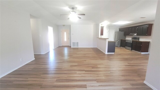 5411 Cypress Cir, Kingsville, TX 78363 - unfurnished living room with light wood finished floors, baseboards, a ceiling fan, and visible vents