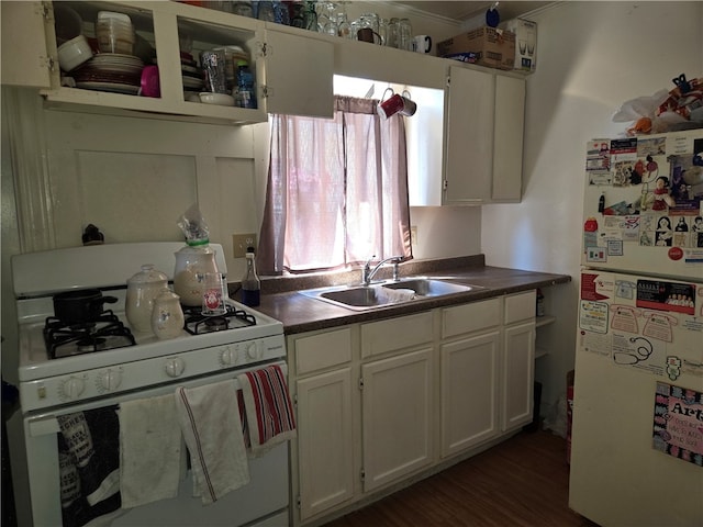 kitchen featuring white cabinetry, dark wood-type flooring, sink, and white appliances