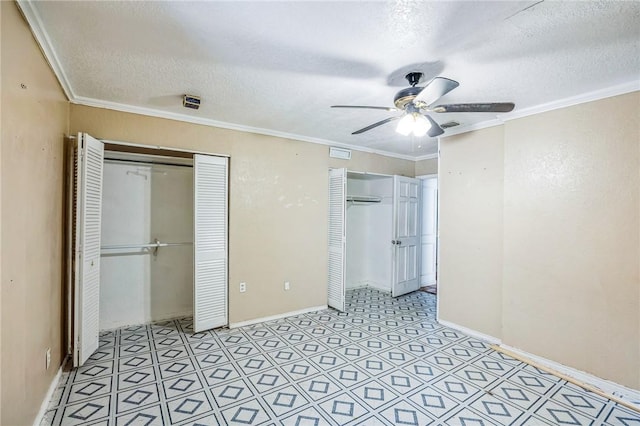 unfurnished bedroom with visible vents, ornamental molding, a textured ceiling, light floors, and multiple closets