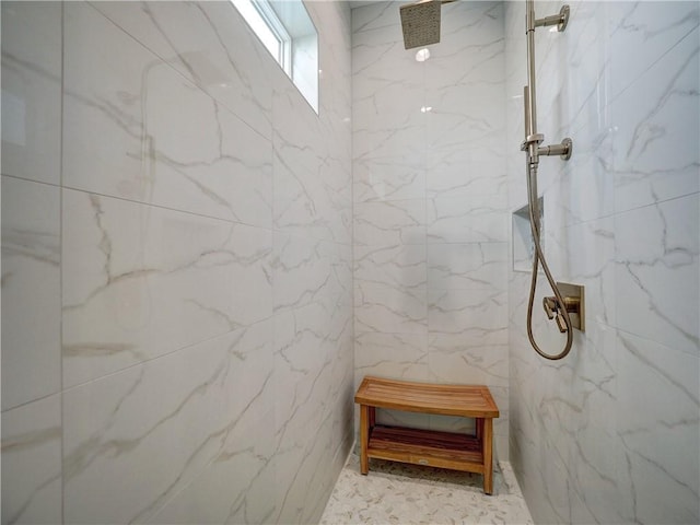 full bath with tile walls and a marble finish shower