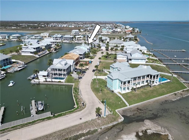 bird's eye view with a water view and a residential view