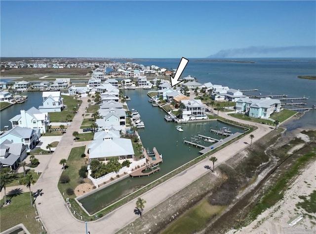 birds eye view of property featuring a water view and a residential view