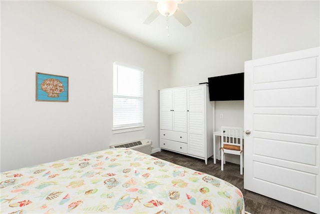 bedroom with an AC wall unit and ceiling fan