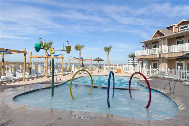 view of pool with fence