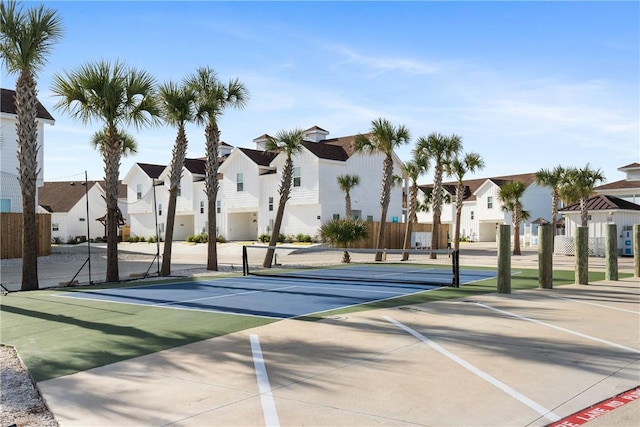 exterior space featuring fence and a residential view