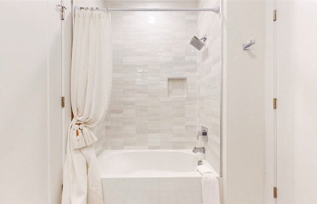 bathroom featuring shower / bath combo with shower curtain