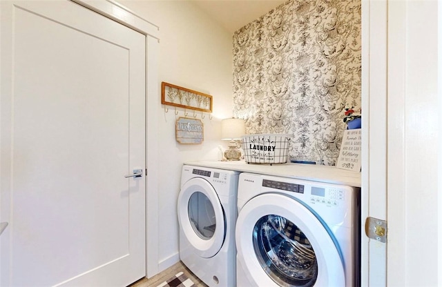 washroom featuring washing machine and dryer