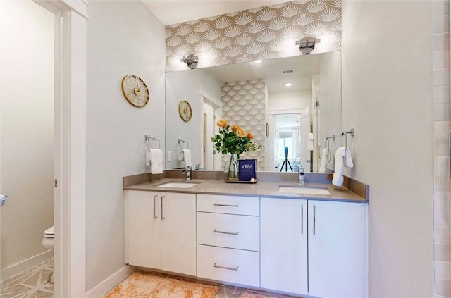 bathroom with vanity and toilet